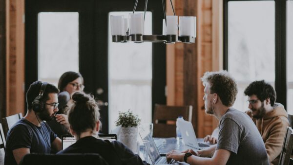 sittin people beside table inside room